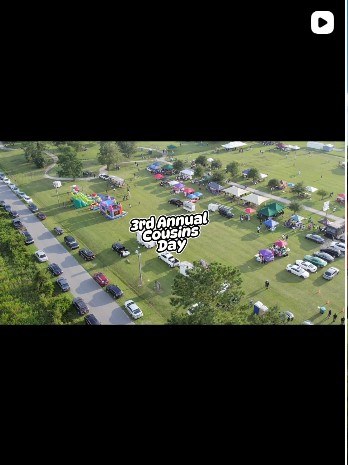 Aerial drone view of the Cousins Day field, tents, and crowd