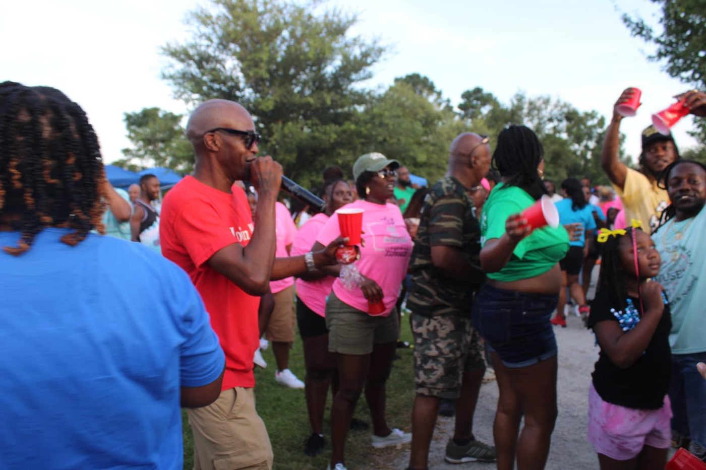 The MC hyping the crowd on the microphone at Cousins Day