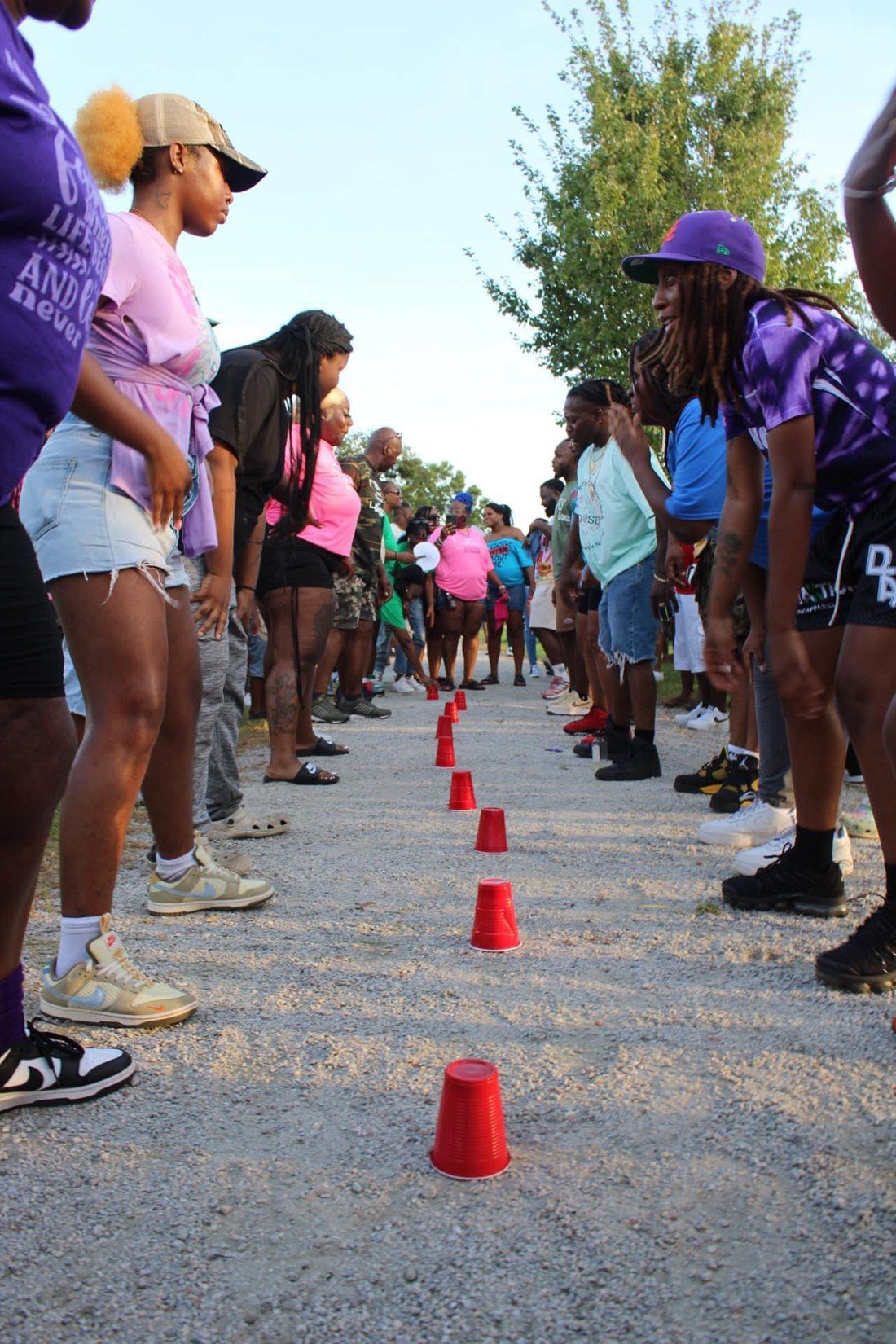 Families lined up along the path for the Red Cup challenge